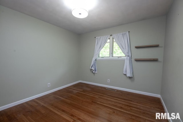 5232 N Merrimac Ave, Peoria, IL 61614 - unfurnished room featuring baseboards and wood finished floors