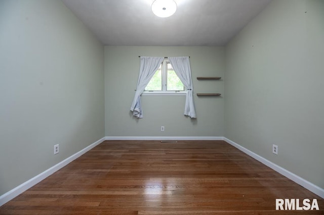 5232 N Merrimac Ave, Peoria, IL 61614 - unfurnished room featuring wood finished floors and baseboards