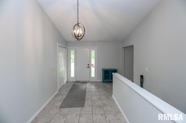 5232 N Merrimac Ave, Peoria, IL 61614 - foyer entrance with vaulted ceiling, a chandelier, and baseboards
