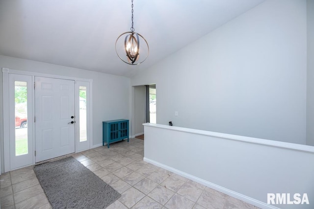 5232 N Merrimac Ave, Peoria, IL 61614 - foyer entrance with a chandelier, vaulted ceiling, baseboards, and light tile patterned floors