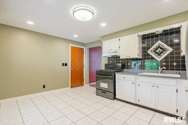 303 W 3rd Ave, Deer Creek, IL 61733 - kitchen featuring black range with gas cooktop, under cabinet range hood, a sink, tasteful backsplash, and white cabinetry