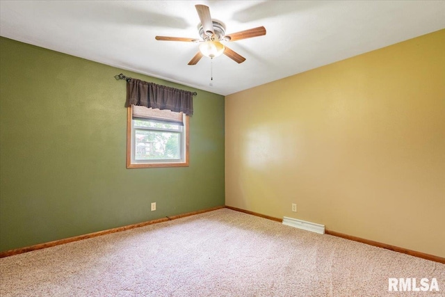 303 W 3rd Ave, Deer Creek, IL 61733 - spare room featuring ceiling fan, carpet floors, and baseboards