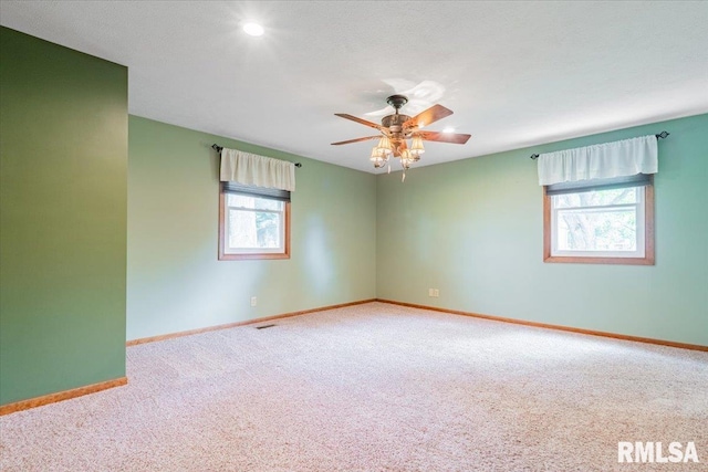 303 W 3rd Ave, Deer Creek, IL 61733 - carpeted spare room with baseboards and a ceiling fan