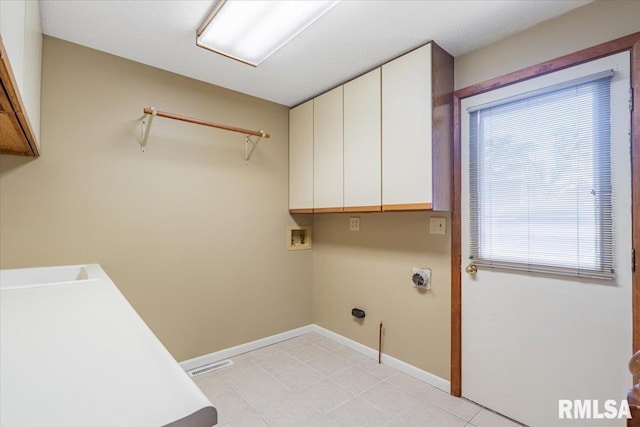 303 W 3rd Ave, Deer Creek, IL 61733 - laundry room with cabinet space, hookup for an electric dryer, hookup for a washing machine, and baseboards