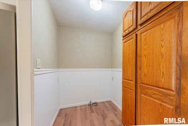 303 W 3rd Ave, Deer Creek, IL 61733 - hallway featuring light wood-style flooring, wainscoting, and baseboards