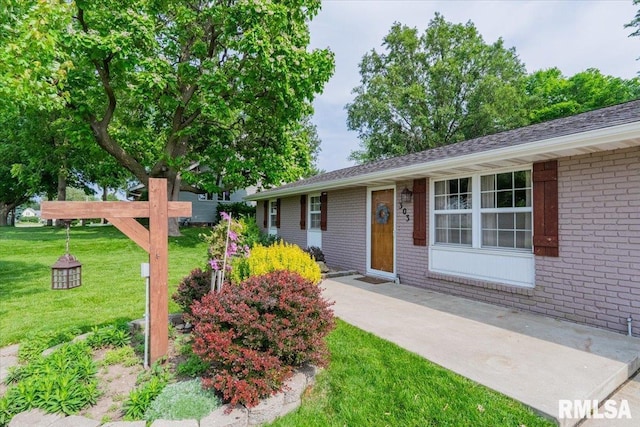 303 W 3rd Ave, Deer Creek, IL 61733 - single story home featuring brick siding and a front yard