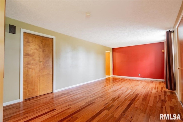 303 W 3rd Ave, Deer Creek, IL 61733 - empty room featuring wood finished floors, a smoke detector, and baseboards