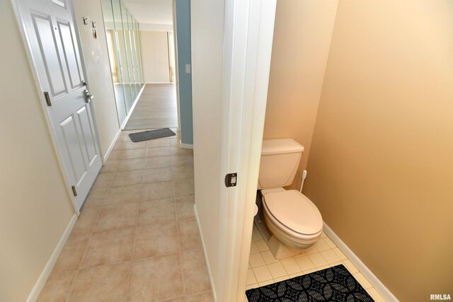 123 SW Jefferson Ave Unit E14A, Peoria, IL 61602 - bathroom with tile patterned flooring, toilet, and baseboards