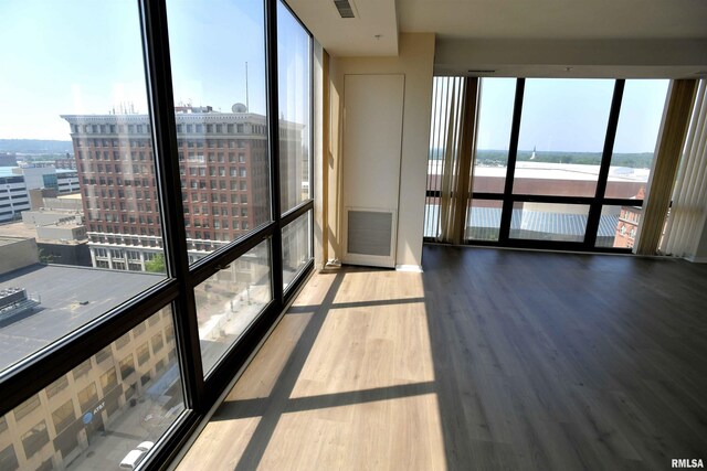 123 SW Jefferson Ave Unit E14A, Peoria, IL 61602 - unfurnished sunroom featuring a water view