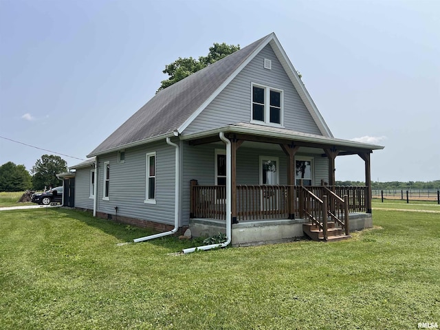 9955 E 750th St, Colchester, IL 62326 - view of front facade with a porch and a front lawn