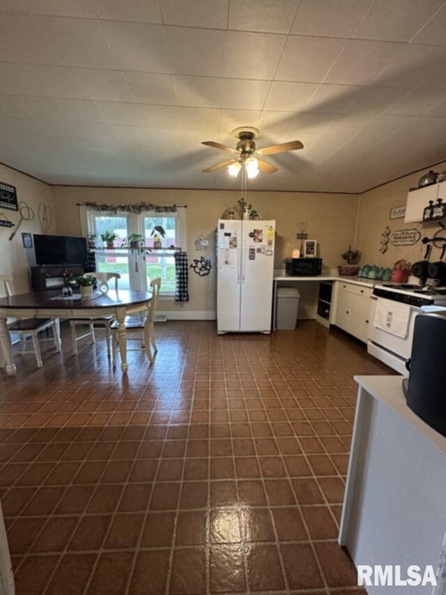 9955 E 750th St, Colchester, IL 62326 - kitchen featuring white appliances, ceiling fan, white cabinets, and french doors