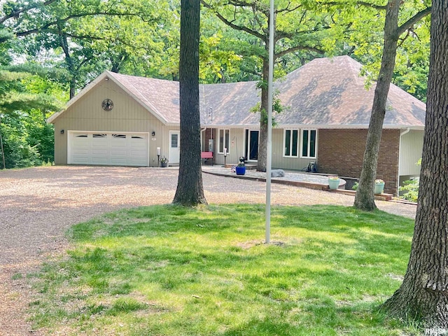 283 Old Germantown Rd, East Peoria, IL 61611 - ranch-style home with dirt driveway, a front yard, a garage, and roof with shingles