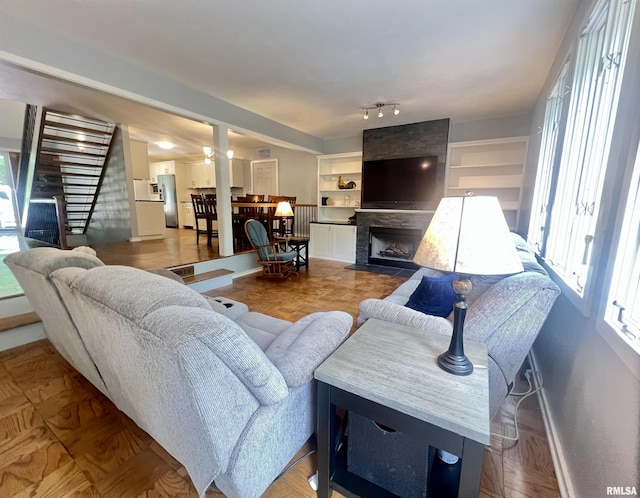 283 Old Germantown Rd, East Peoria, IL 61611 - living area featuring stairs, baseboards, and a fireplace