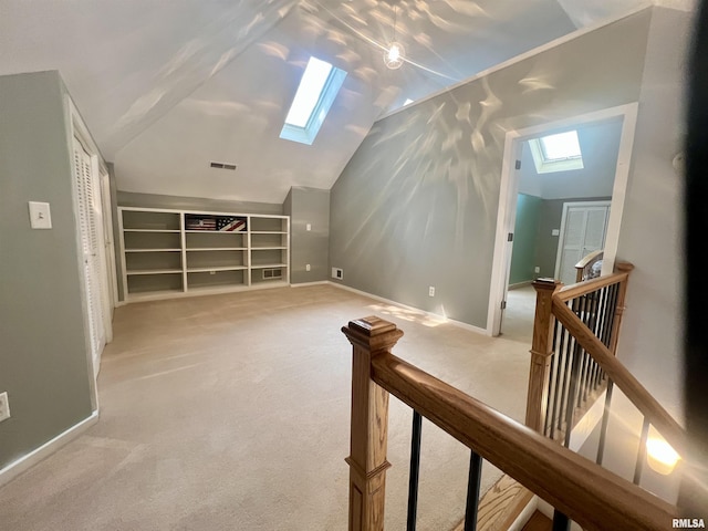 283 Old Germantown Rd, East Peoria, IL 61611 - additional living space with a skylight, lofted ceiling, light colored carpet, and baseboards