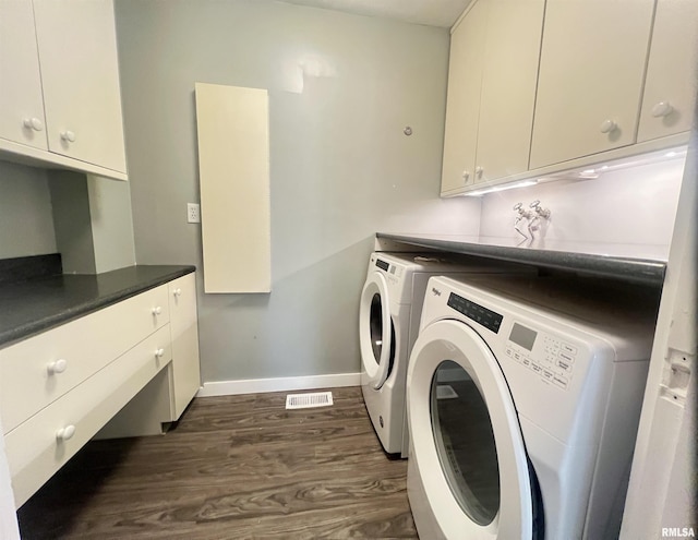 283 Old Germantown Rd, East Peoria, IL 61611 - laundry room with washer and clothes dryer, cabinet space, dark wood-style flooring, and baseboards