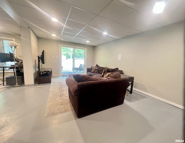 283 Old Germantown Rd, East Peoria, IL 61611 - living room featuring finished concrete floors, recessed lighting, baseboards, and a paneled ceiling