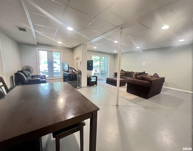 283 Old Germantown Rd, East Peoria, IL 61611 - dining room featuring concrete floors, a drop ceiling, and recessed lighting