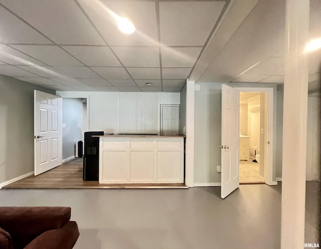 283 Old Germantown Rd, East Peoria, IL 61611 - kitchen with a drop ceiling, white cabinets, and baseboards