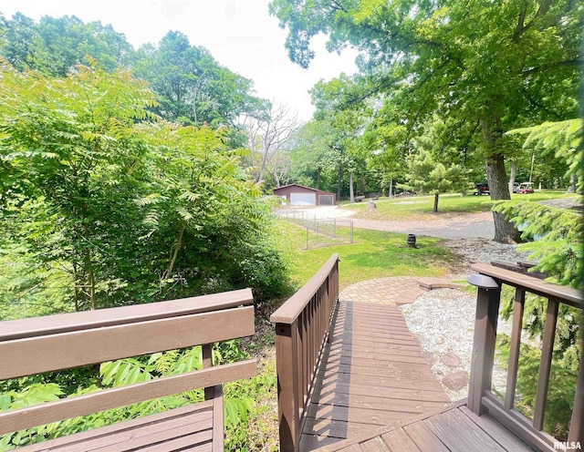283 Old Germantown Rd, East Peoria, IL 61611 - wooden deck featuring a detached garage and view of wooded area