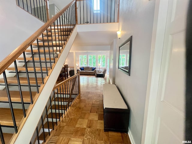 283 Old Germantown Rd, East Peoria, IL 61611 - corridor with a high ceiling, stairway, and baseboards