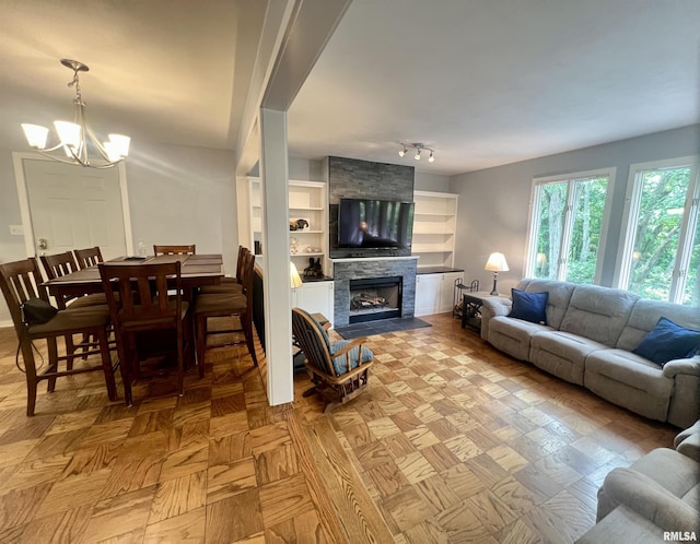 283 Old Germantown Rd, East Peoria, IL 61611 - living room featuring a chandelier and a fireplace