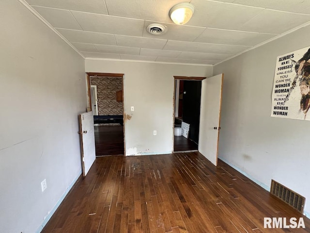 836 S Johnson St, Macomb, IL 61455 - empty room featuring hardwood / wood-style flooring and crown molding