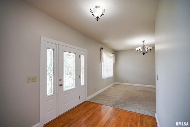 521 S French Dr, Dunlap, IL 61525 - foyer entrance with a chandelier and light wood-style floors