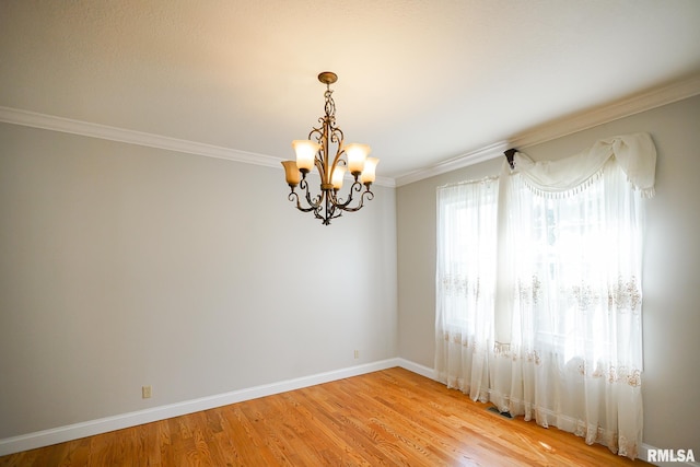 521 S French Dr, Dunlap, IL 61525 - empty room featuring a chandelier, crown molding, and light wood-style floors