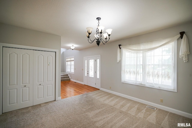 521 S French Dr, Dunlap, IL 61525 - carpeted entrance foyer featuring a chandelier and stairs