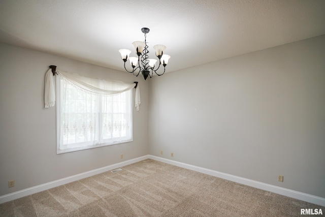 521 S French Dr, Dunlap, IL 61525 - empty room featuring a chandelier and light carpet