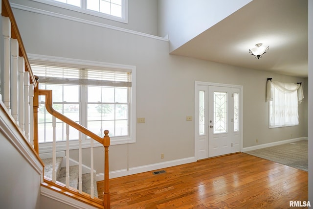 521 S French Dr, Dunlap, IL 61525 - entrance foyer featuring stairs, healthy amount of natural light, wood finished floors, and a high ceiling