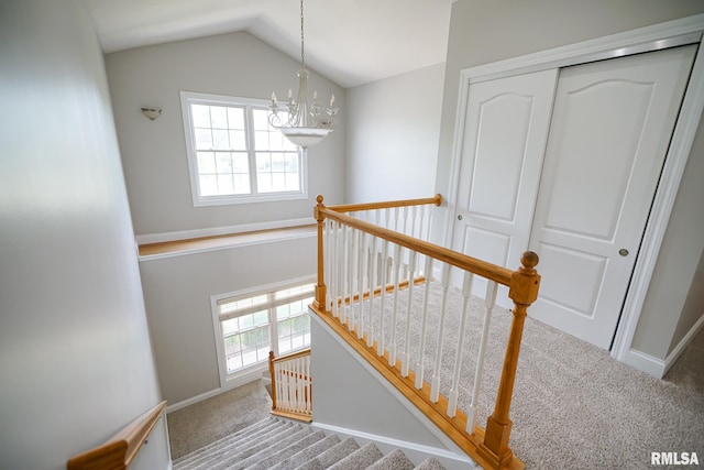 521 S French Dr, Dunlap, IL 61525 - staircase featuring carpet floors, a chandelier, and lofted ceiling