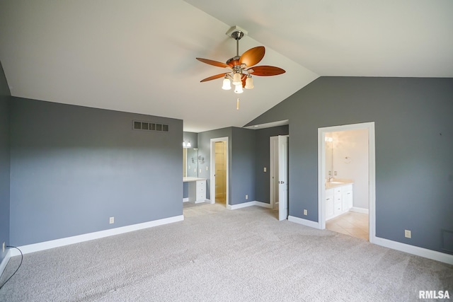 521 S French Dr, Dunlap, IL 61525 - unfurnished bedroom featuring vaulted ceiling, light carpet, connected bathroom, and a ceiling fan