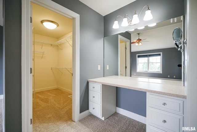 521 S French Dr, Dunlap, IL 61525 - bathroom featuring ceiling fan and a spacious closet