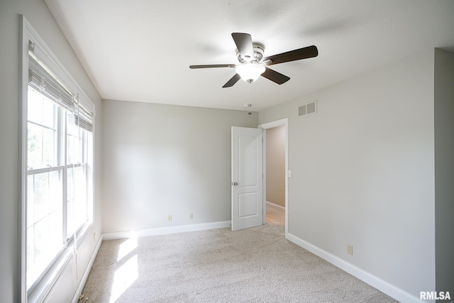 521 S French Dr, Dunlap, IL 61525 - unfurnished room featuring a ceiling fan and light carpet