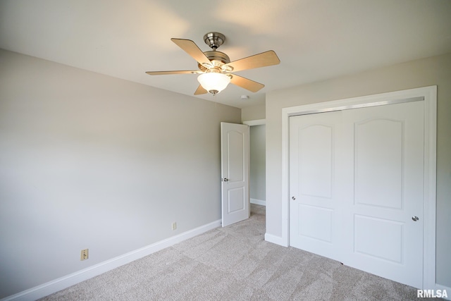 521 S French Dr, Dunlap, IL 61525 - unfurnished bedroom with light colored carpet, a closet, and a ceiling fan