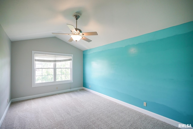 521 S French Dr, Dunlap, IL 61525 - empty room with lofted ceiling, carpet, and a ceiling fan