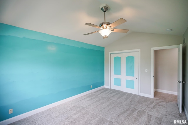 521 S French Dr, Dunlap, IL 61525 - unfurnished bedroom featuring a closet, vaulted ceiling, carpet floors, and a ceiling fan