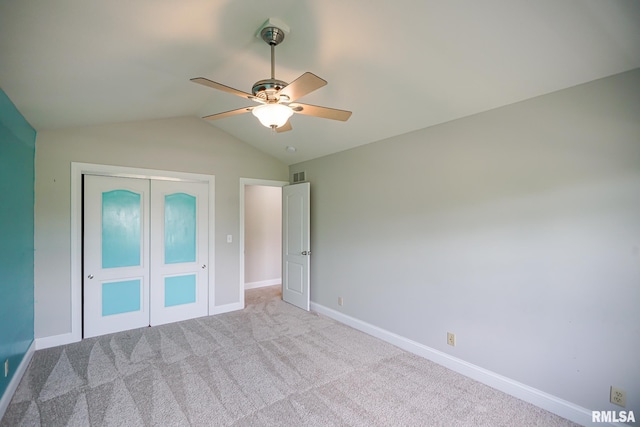 521 S French Dr, Dunlap, IL 61525 - unfurnished bedroom featuring a closet, lofted ceiling, carpet floors, and ceiling fan