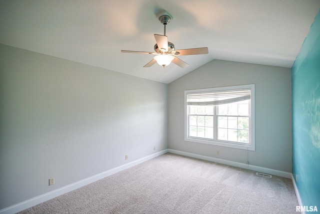521 S French Dr, Dunlap, IL 61525 - unfurnished room featuring a ceiling fan, vaulted ceiling, and light carpet