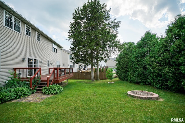 521 S French Dr, Dunlap, IL 61525 - view of yard featuring a deck and an outdoor fire pit