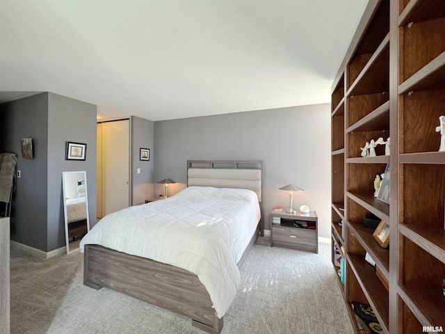 4444 N Knoxville Ave Unit 301, Peoria, IL 61614 - bedroom with carpet floors and baseboards