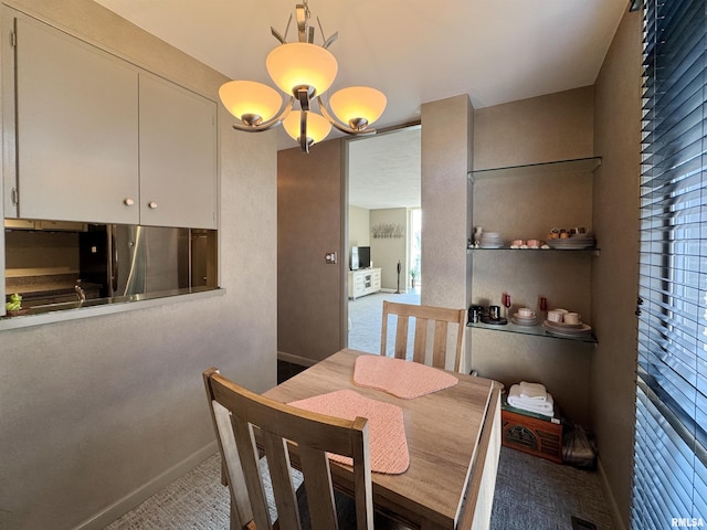 4444 N Knoxville Ave Unit 301, Peoria, IL 61614 - dining room with a chandelier