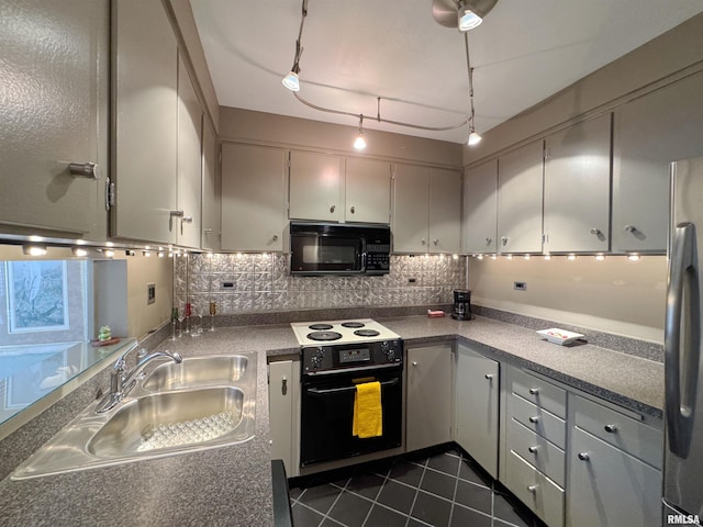 4444 N Knoxville Ave Unit 301, Peoria, IL 61614 - kitchen featuring black appliances, a sink, decorative backsplash, dark tile patterned floors, and gray cabinetry