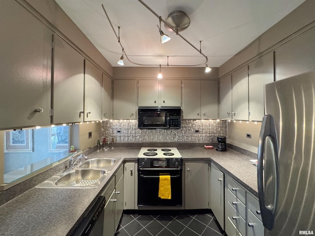 4444 N Knoxville Ave Unit 301, Peoria, IL 61614 - kitchen featuring black appliances, a sink, tasteful backsplash, dark tile patterned floors, and track lighting