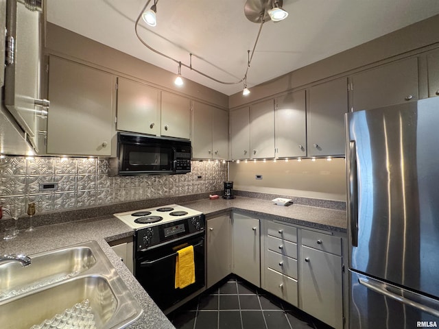 4444 N Knoxville Ave Unit 301, Peoria, IL 61614 - kitchen with black appliances, a sink, tasteful backsplash, and dark tile patterned flooring