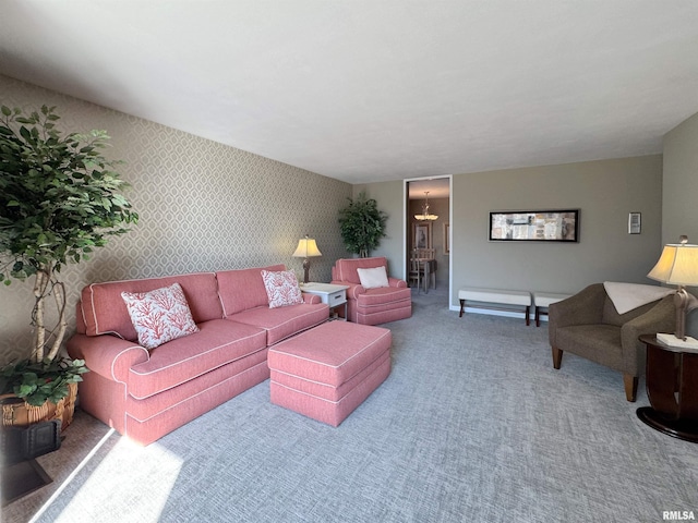 4444 N Knoxville Ave Unit 301, Peoria, IL 61614 - carpeted living room featuring wallpapered walls, a chandelier, and baseboards
