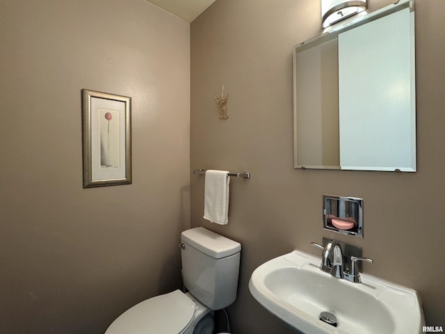 4444 N Knoxville Ave Unit 301, Peoria, IL 61614 - half bathroom with a sink and toilet