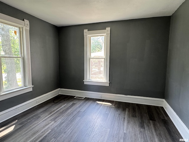 305 E Republic St, Peoria, IL 61603 - unfurnished room featuring dark wood finished floors and baseboards