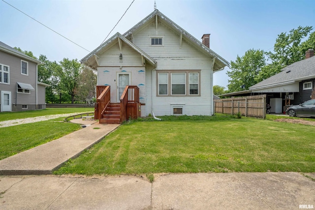 602 W Adams St, Abingdon, IL 61410 - view of front of home with a front yard and a chimney